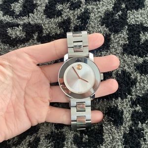 Ladies movado watch. Needs new battery, no extra cuff links. Hardly worn.
